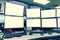 Group of blank monitors and screen on security desk or control room for monitor process or stock data trading