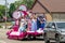 Group of Blossom-time royalty ride on a float