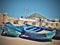 Group of blue fishing boats on the shore at the pier in the city of Essaouira Morocco