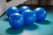 Group of blue pilates balls in gym
