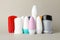 Group of body deodorants on gray background blank space for text