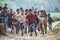 Group of boisterous Indian children running for photograph in Agra, Uttar Pradesh, India