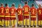 Group of boys football soccer futsal players standing together. Youth school indoor soccer tournament competition. Kids watching s