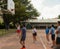 Group of boys and girls of different ages playing basketball