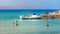 Group of boys having fun at the beautiful beach in Istron, Crete, Greece