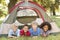 Group Of Boys Having Fun In Tent In Countryside