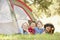 Group Of Boys Having Fun In Tent In Countryside