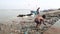 Group of boys playing at dirty shore of Ganges.