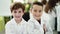 Group of boys scientists students smiling confident standing with arms crossed gesture at laboratory classroom