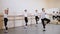Group of Boys Students in Ballet School Repeat Exercise after their Teacher