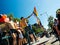 Group of boys waving gay pride flag