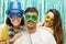 Group of Brazilian friends wearing Carnaval costume. Masked revelers pose for the photo..