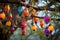 a group of brightly colored diwali lanterns hanging from a tree