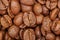 Group of brown coffee grains background, macro, close-up