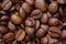 Group of brown coffee grains background, macro, close-up