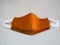 Group Brown color mask self prevention ill on desk made of fabric for protect dust and germs pm 2.5, coronavirus covid-19