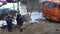 A group of builders at the construction site works outside in winter.