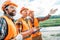 group of builders in hard hats and reflective vests