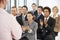 Group Of Business People Applauding Speaker At The End Of A Presentation