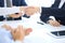 Group of business people or lawyers shaking hands finishing up a meeting , close-up. Success at negotiation and