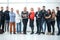 Group of business people in an office lined up