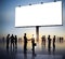 Group Of Business People Silhouettes Outdoors And An Empty Billboard Above