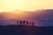 Group of business people standing on a hill