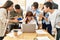 Group of business workers screaming to stressed partner at the office