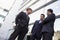 Group of businessmen talking outside office