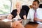 Group Of Businesspeople Having Meeting On Train