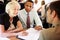 Group Of Businesspeople Having Meeting On Train