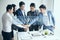 Group of businesspeople making handshake unity in office.