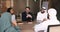 Group of businesspeople negotiating sit at desk in office