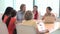 Group Of Businesswomen Meeting Around Desk In Office