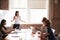 Group Of Businesswomen Meeting In Modern Boardroom