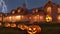 A Group Of Carved Pumpkins Sitting In Front Of A House. Generative AI