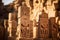 a group of carved wooden statues in front of some rocks