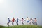 Group Casual People Walking Together Outdoors Concept