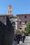 Group of catholic priests in black cassocks walking on a street of Rome