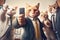 Group of cats in a business suit and tie holding a smartphone