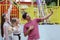 Group of Caucasian friends enjoy selfie on mobile phone at theme park