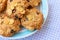 Group of cereal cookies in plate on table with tablecloth