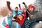 Group of cheerful friends with ski on winter holidays - Skiers h