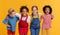 Group of cheerful happy multinational children on yellow background