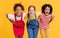 Group of cheerful happy multinational children on yellow background