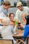 Group of cheerful people toasting with cocktails