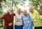 Group of cheerful senior runners at the park