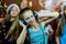 Group of cheerful young girls celebrating Christmas. Headphones