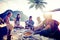 Group of Cheerful Young People Relaxing on a Beach