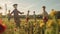 a group of children and adults building scarecrows in a vibrant farm field on a sunny afternoon, AI Generated